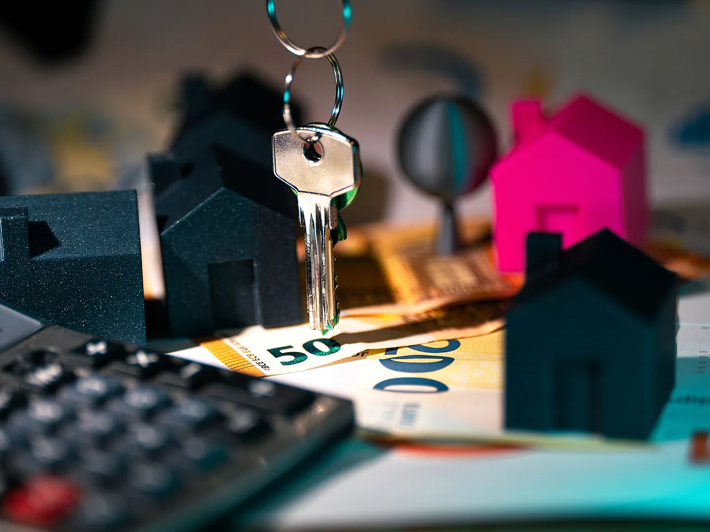 House models and keys representing home loan finance