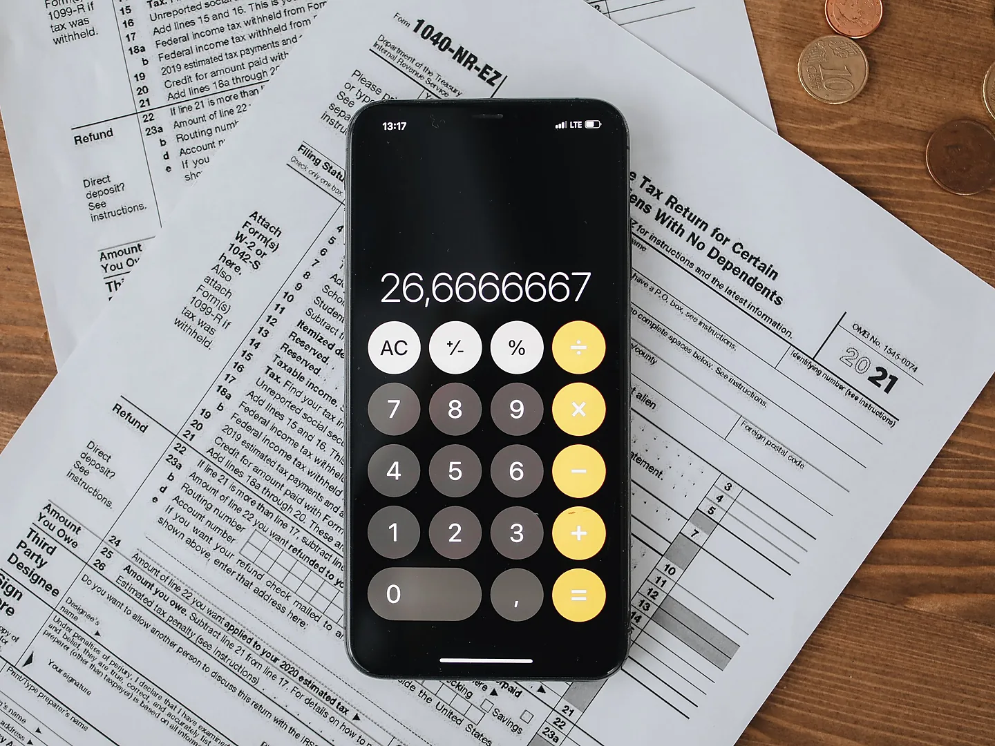 Income tax return documents being reviewed with a calculator