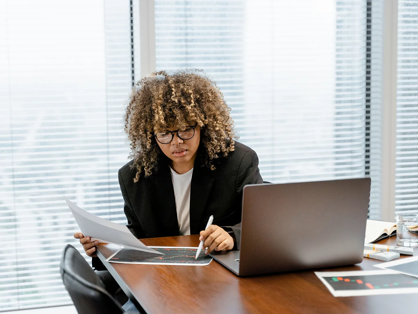 Financial professional reviewing charts for tax planning